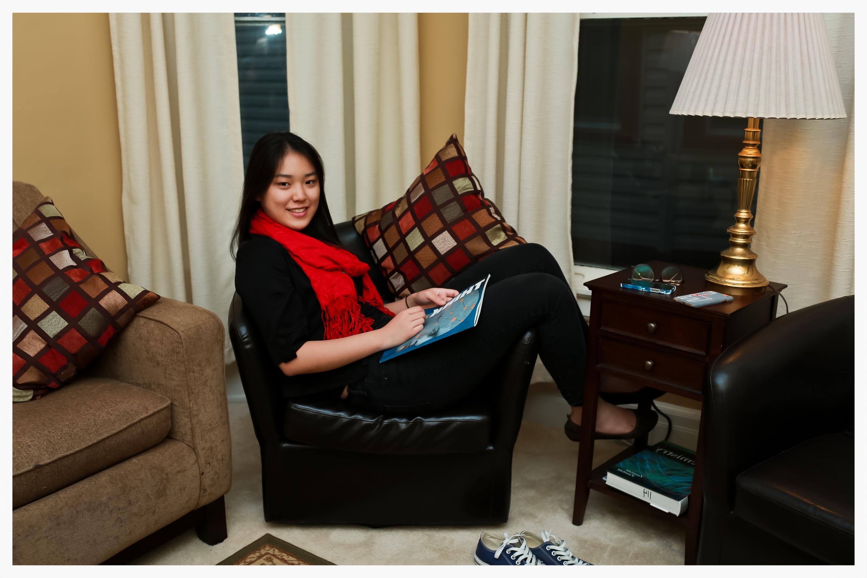 students reading in living room of a house